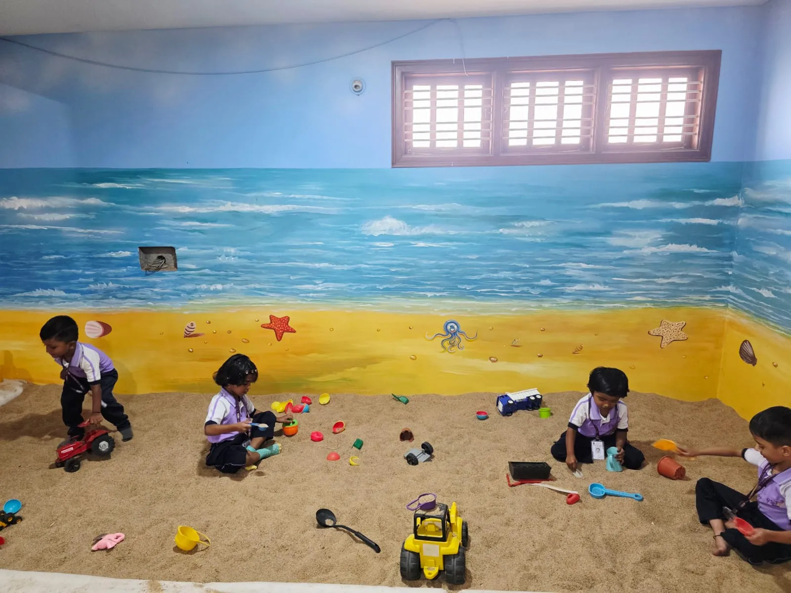 Indoor play area with colorful toys and slides