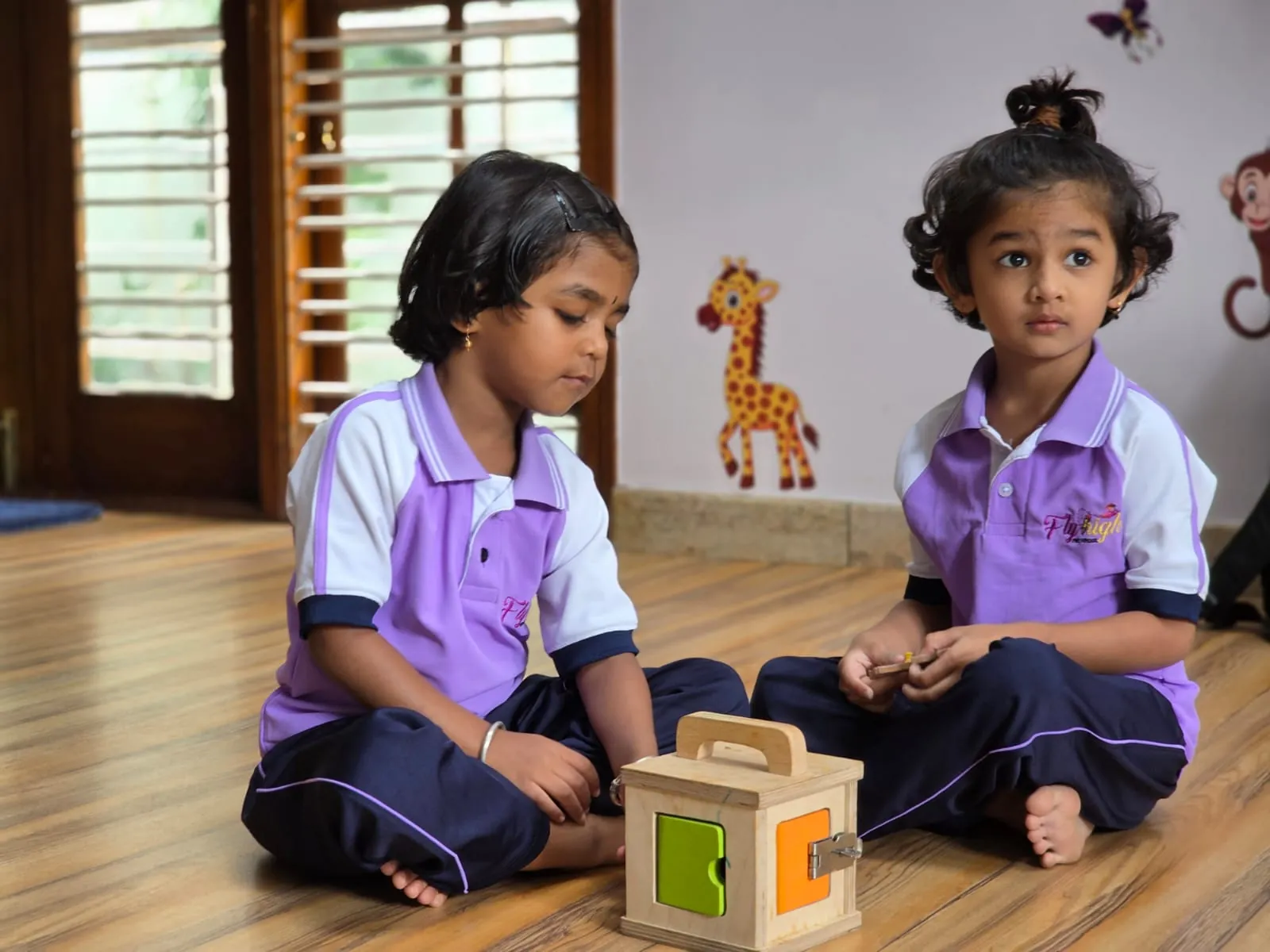Kindergarten children learning with teacher
