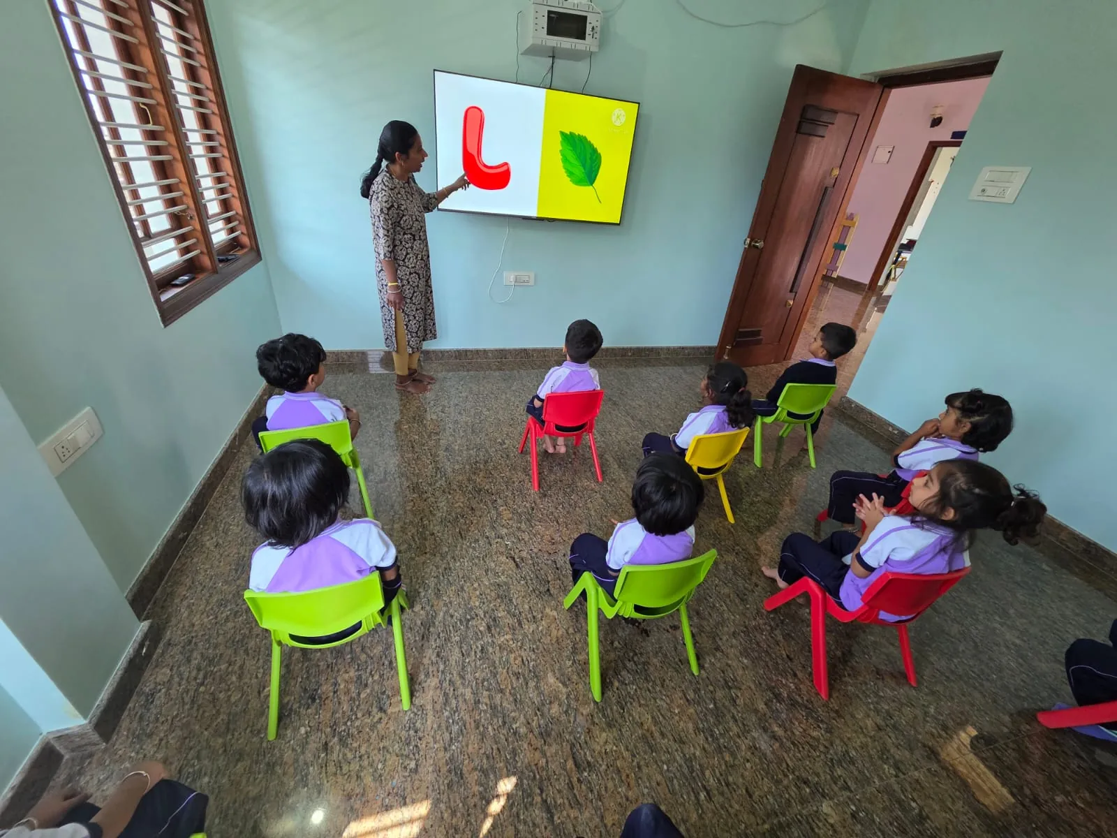 Children playing with building blocks in playgroup class